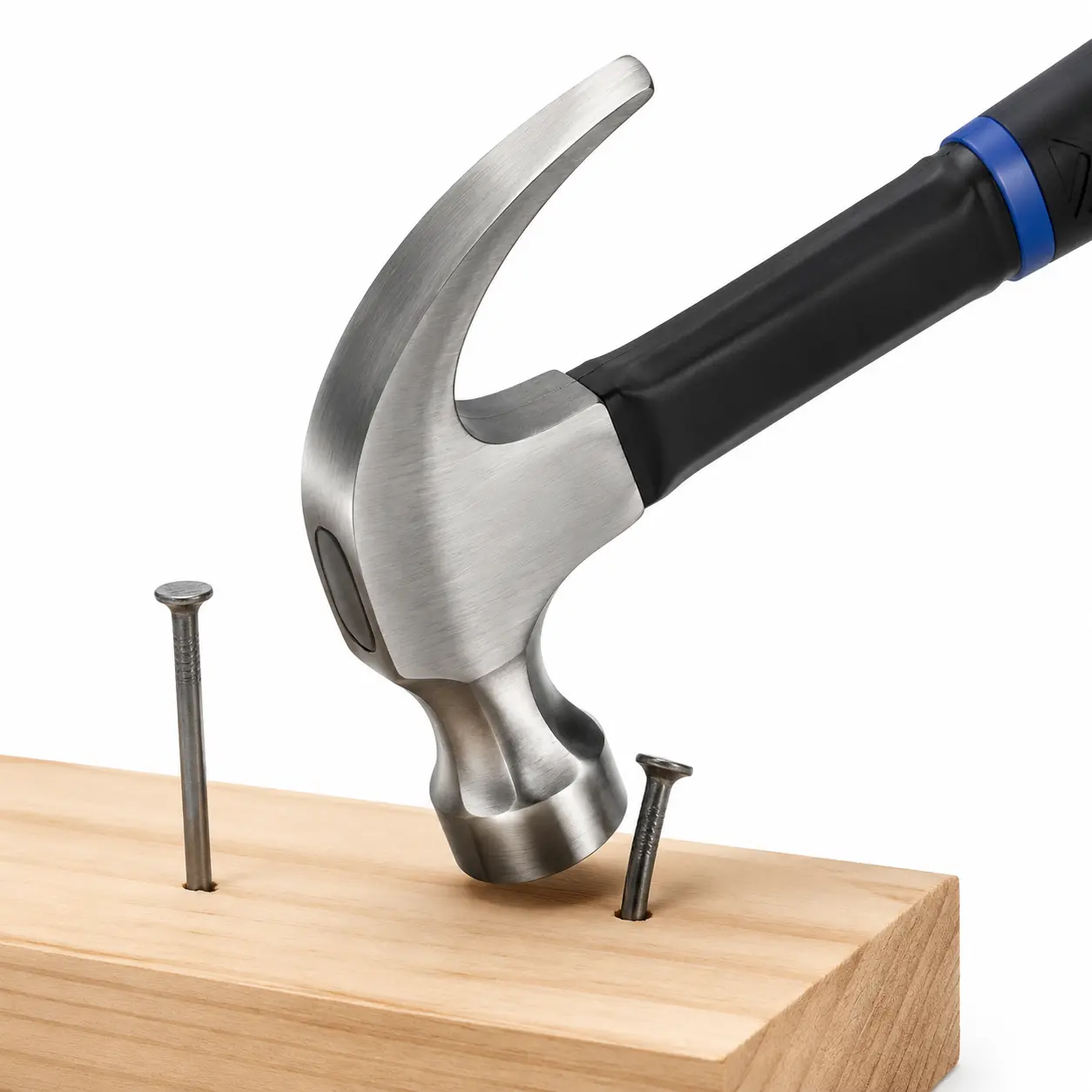 Claw hammer head pulling and driving nails in wood for hardware repair work